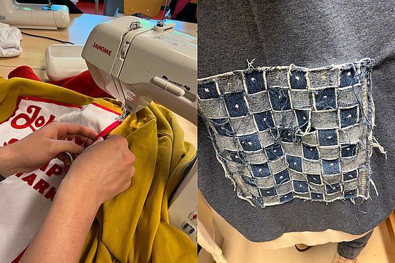 Person syr på en symaskin medan en tröja dekoreras med återbrukat denimtyg. Fokus på kreativt textilhantverk, hållbar design och återbruk.