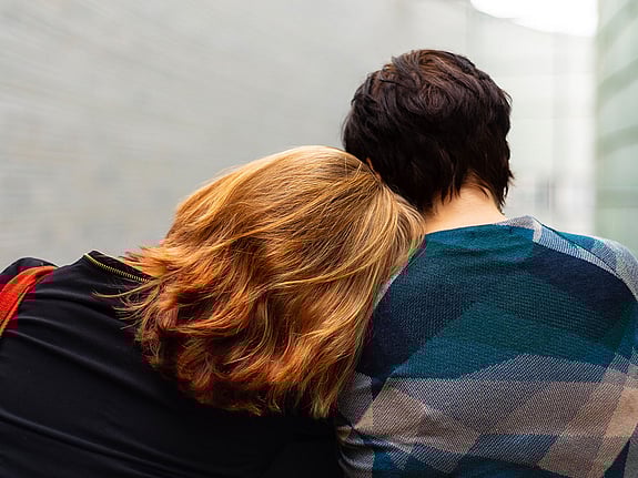 Two girls sitting together