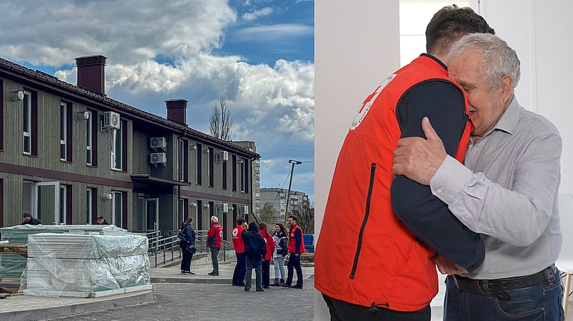 Bild på husen i Sumy och två män som kramas