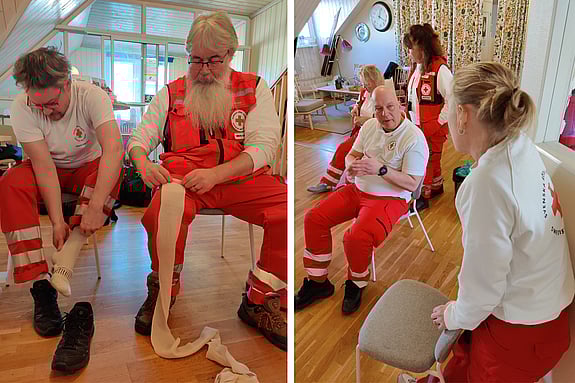 Deltagare i Förstahjälpen-gruppen i sina röda arbetskläder visar olika övningsmoment.