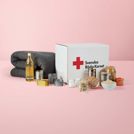 En ullfilt inslagen i en röd rosett.